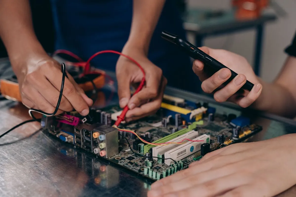 Technician diagnosing a circuit board with a multimeter